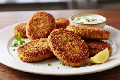 Eggless Chicken Cutlets – Simple Homemade Snack served in plate with a piece of lemon